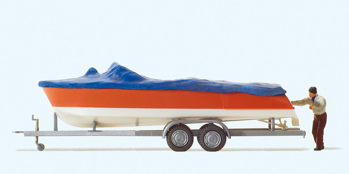 Motorboat w/Cover on Trailer